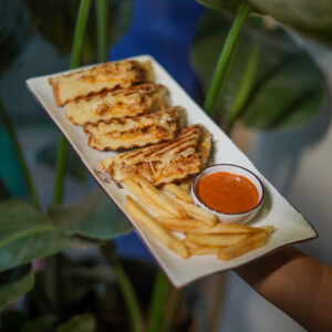 Golden. Gooey. Grilled to perfection. Grilled cheese sandwich with fries and dip